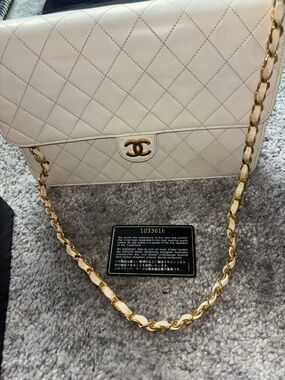 CHANEL Quilted Medium Flap Bag in Cream with Gold Hardware.